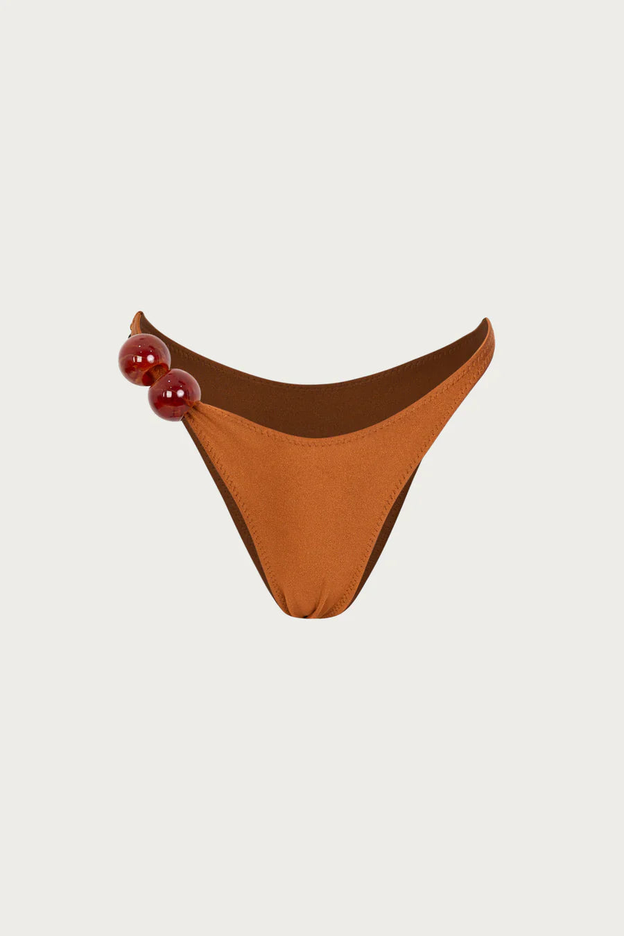 Designer sculpting bikini bottom silhouettes for beach clubs